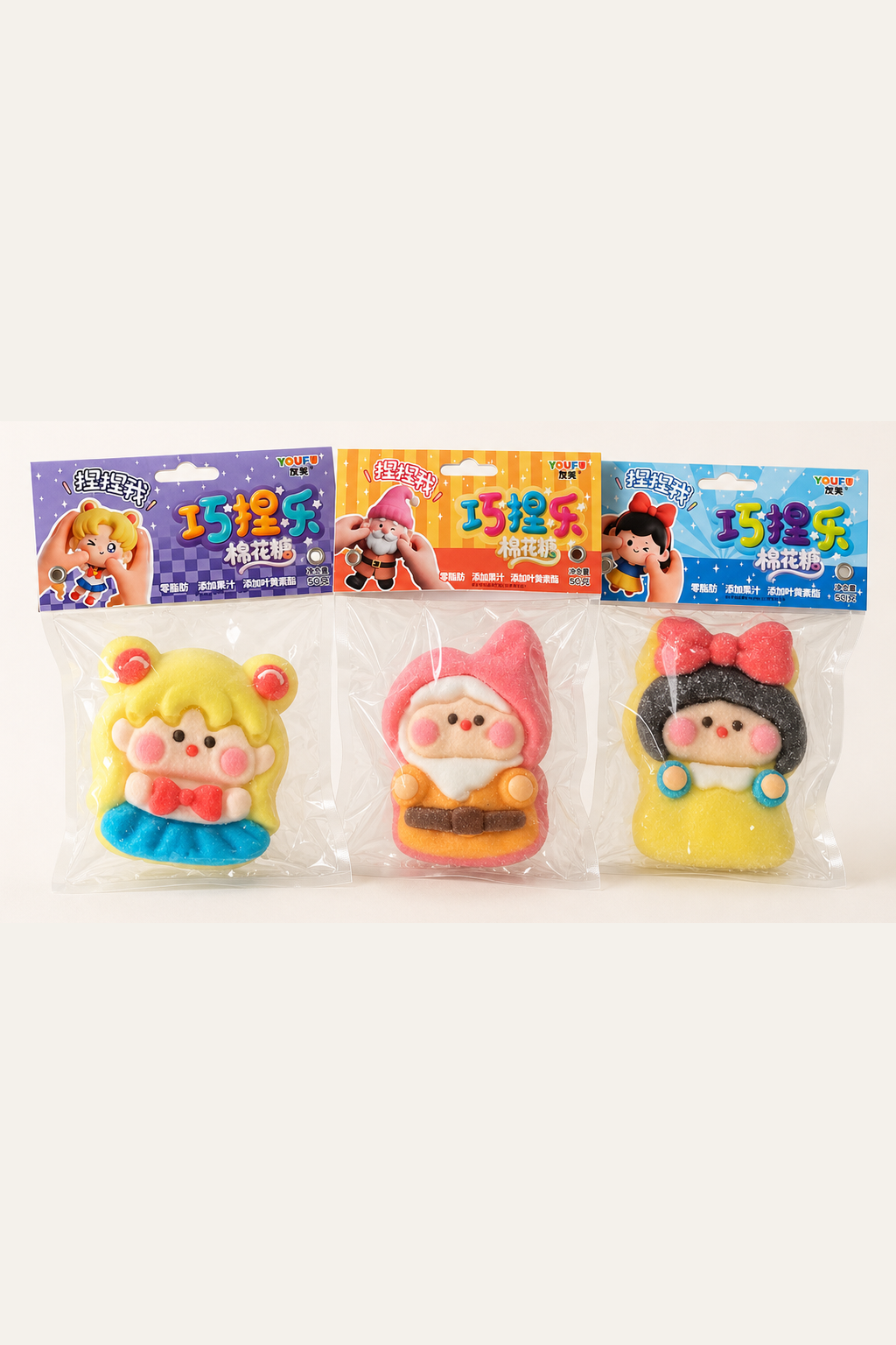 Original supplied reference photo of three colorful shaped marshmallow packages